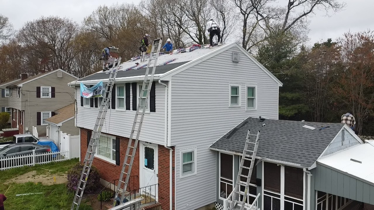 Storm King Roofing Corp team and work vehicle in Avon